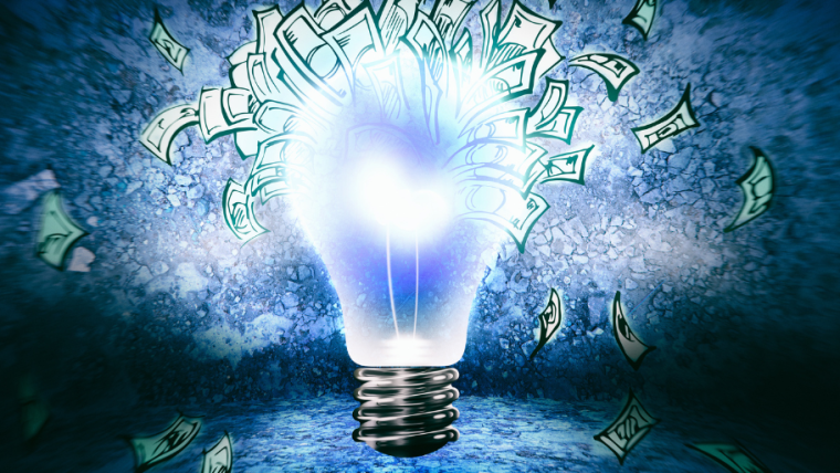 An image of a lightbulb with money (notes) flying around it.